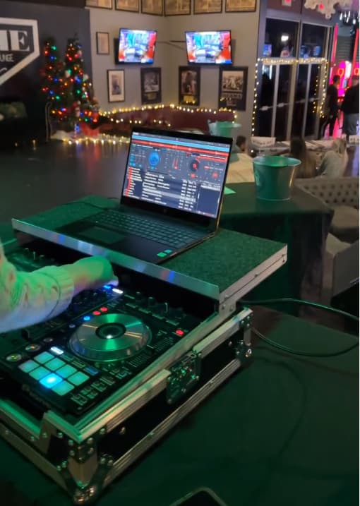 A DJ mixing on decks during a night at HOME