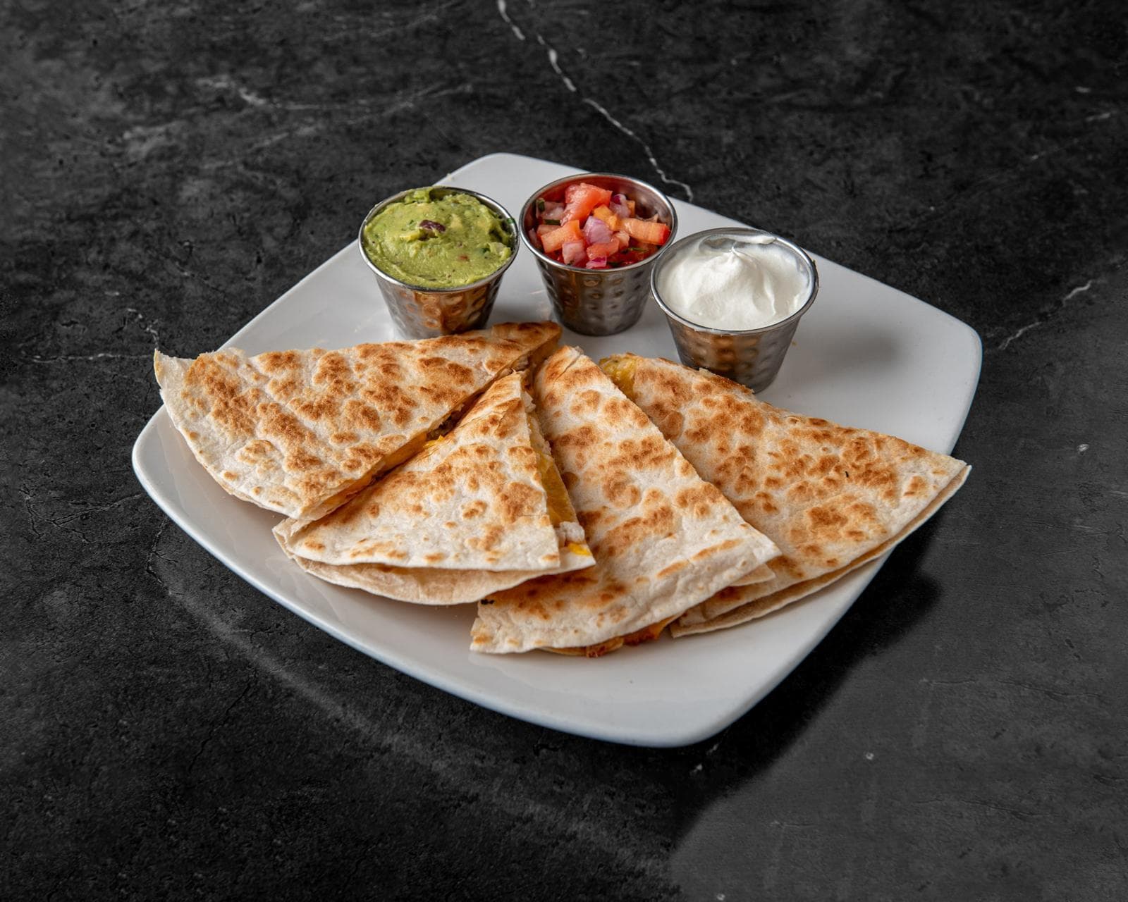 Cheese quesadilla with guacamole, pico de gallo and sour cream