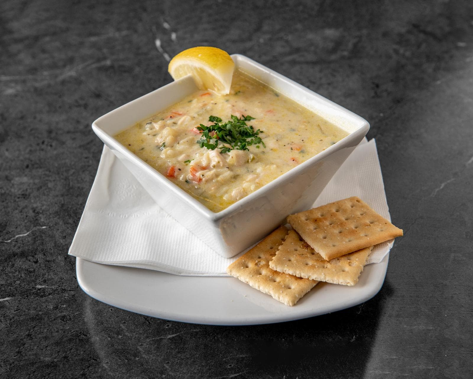 Chicken lemon rice soup served with crackers