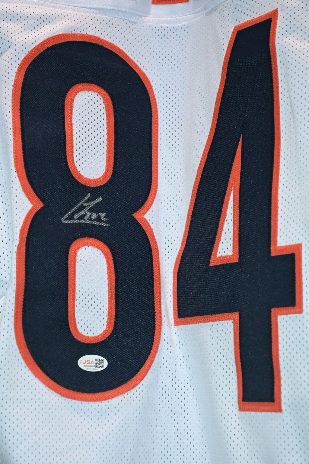 Close-up of a signed Bears #84 jersey